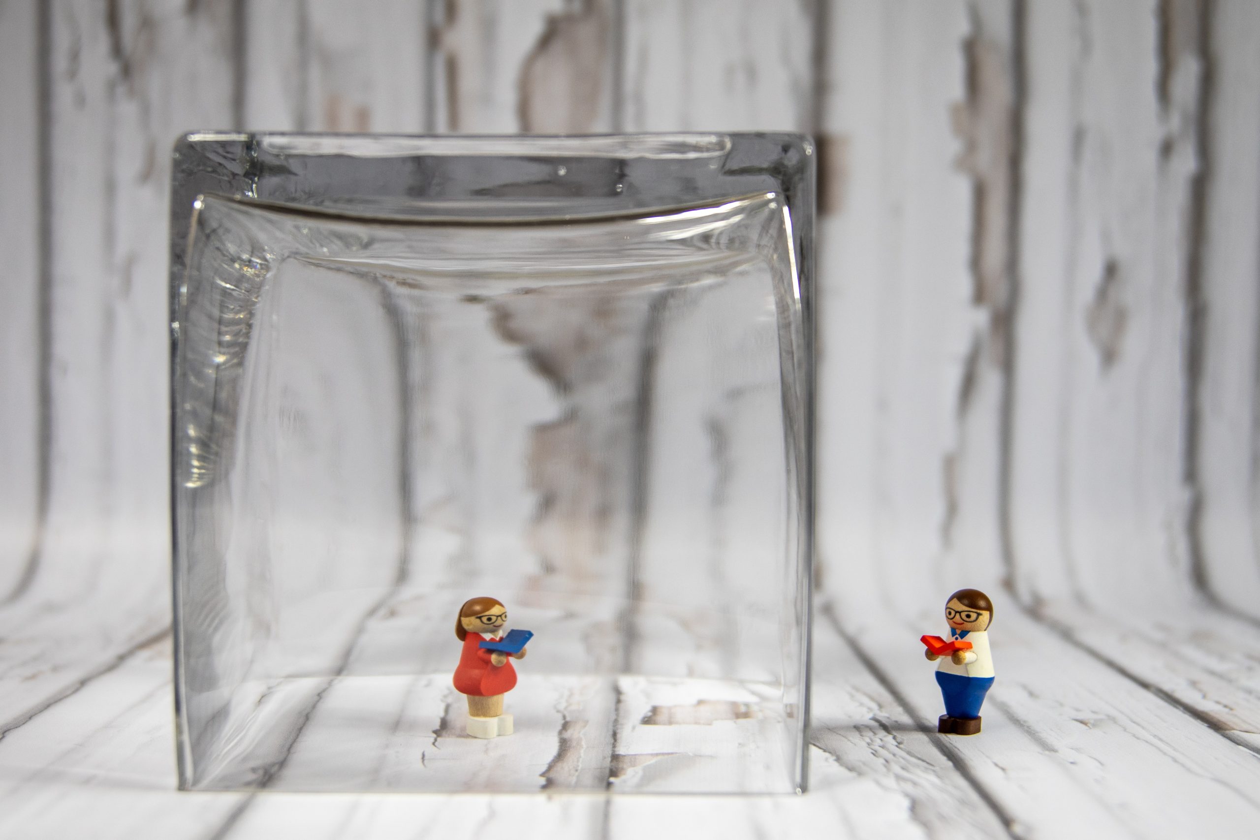 Social distancing Lego figures with glass vase