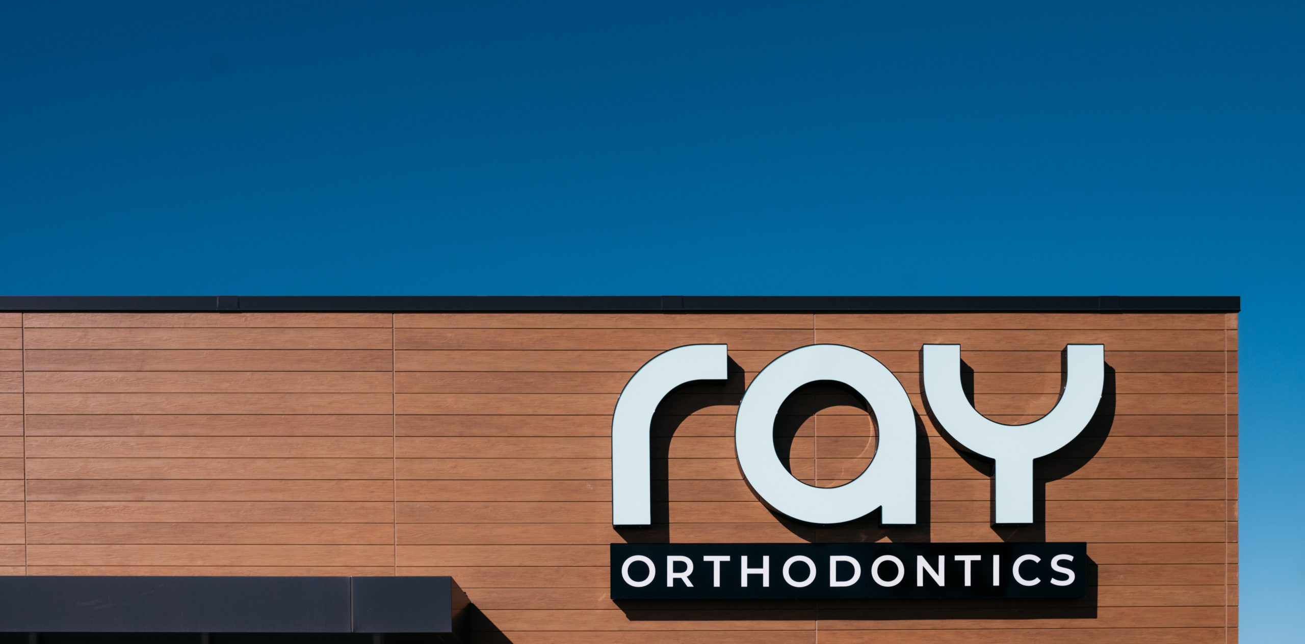 Ray orthodontics building sign