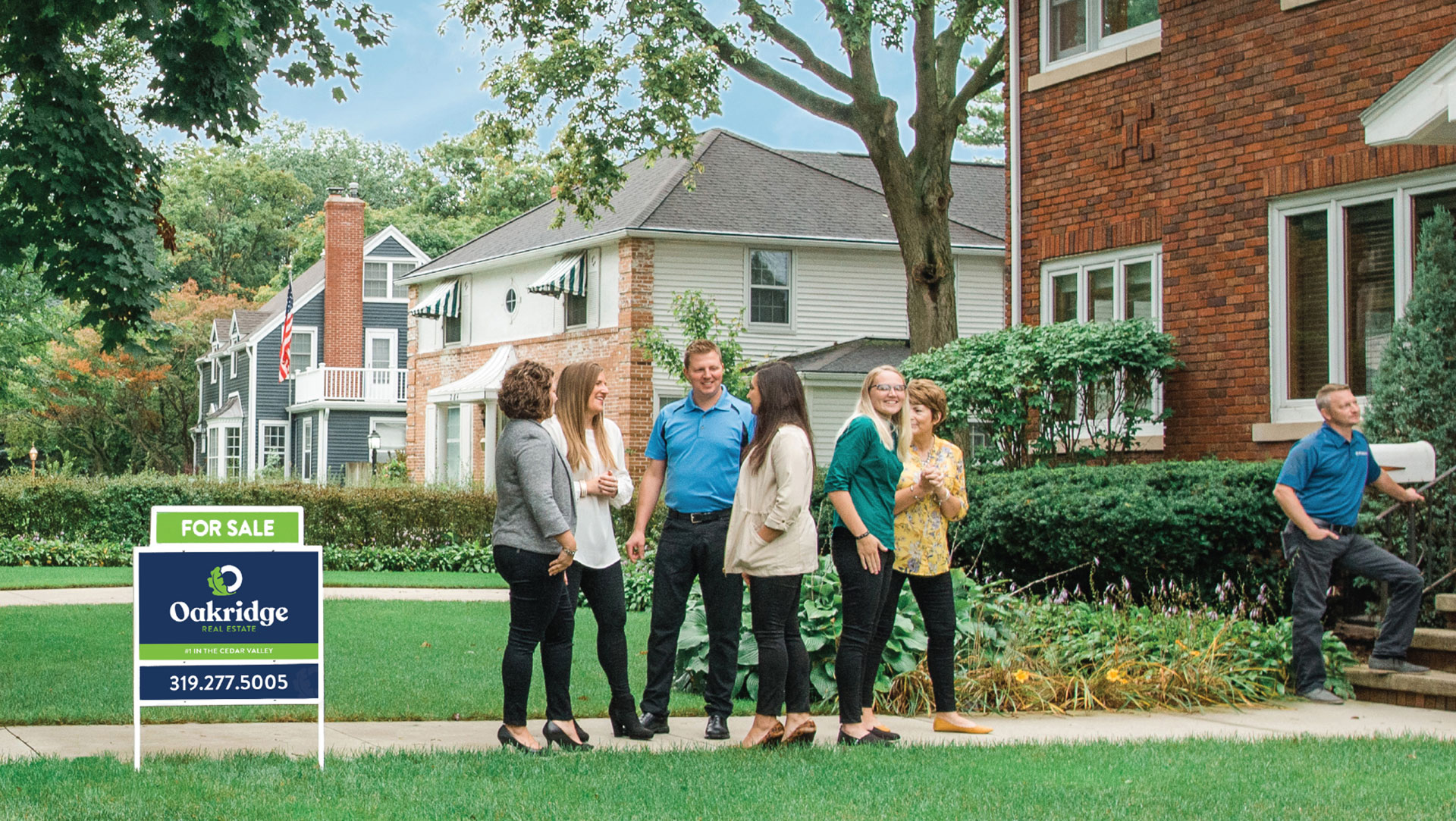 Oakridge Real Estate realtors talking with home buyers